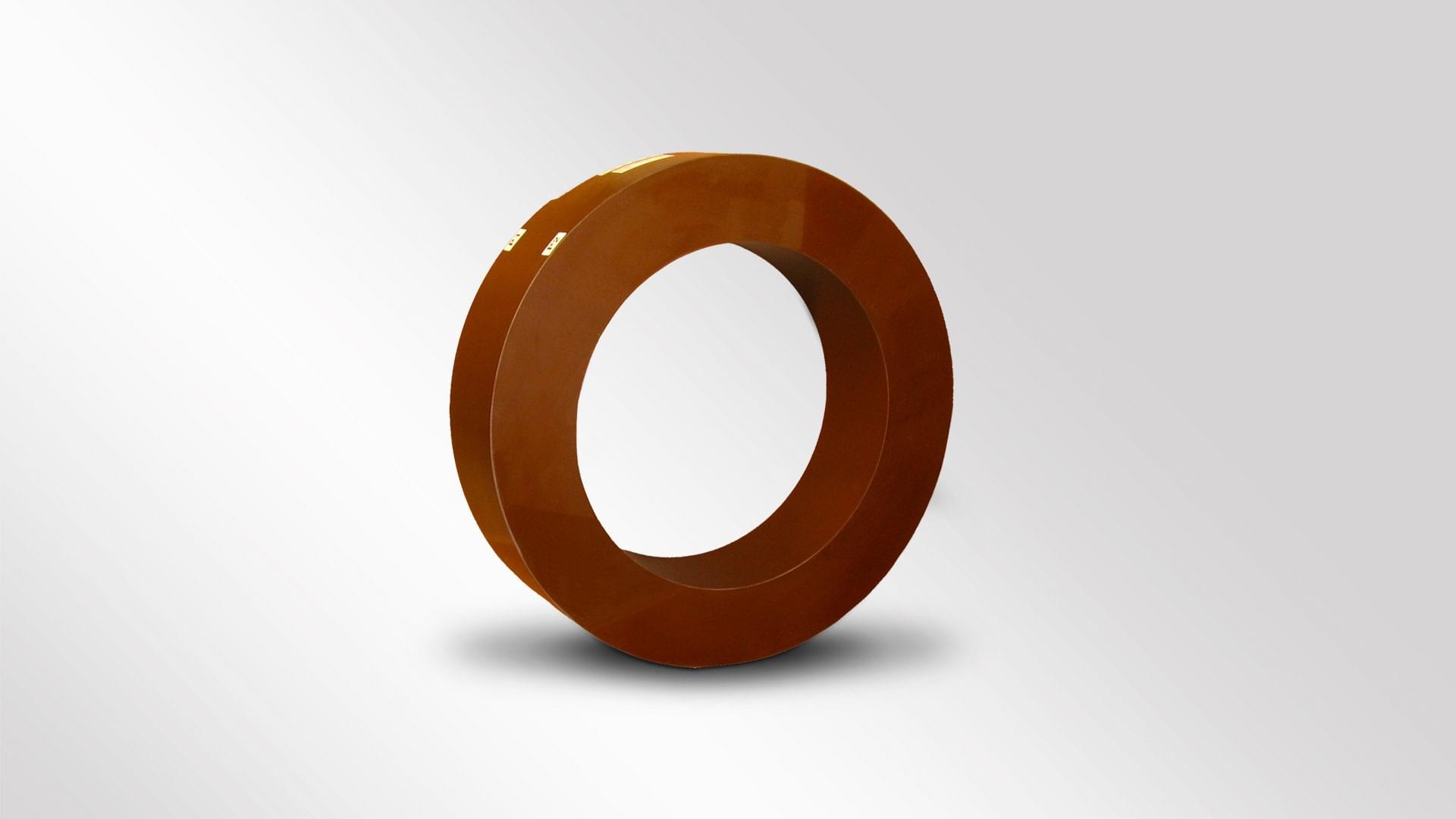 A brown toroidal current transformer that is installed in high-voltage switchgear and is particularly important for protection applications and high-voltage technology